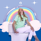 Woman sitting on toilet using PODDI Bidet and laughing. PODDI Clean Wash Bidet attachment with dual nozzle for front & rear wash. Ultra-slim design that fits every standard toilet.